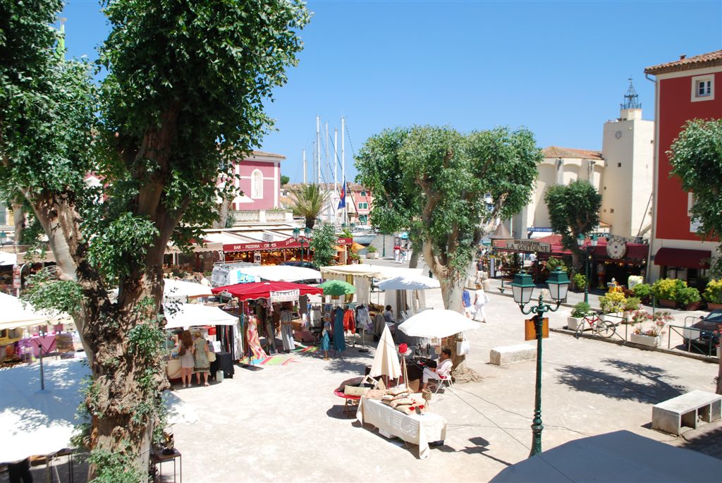 The Market Square in Port Grimaud. In the background, you can see the church where François Spoerry, the creator of Port Grimaud, is buried.